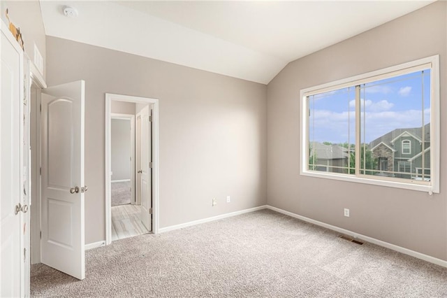 1532 SW Cross Creek Dr, Lees Summit, MO 64082 - unfurnished bedroom featuring carpet flooring and lofted ceiling
