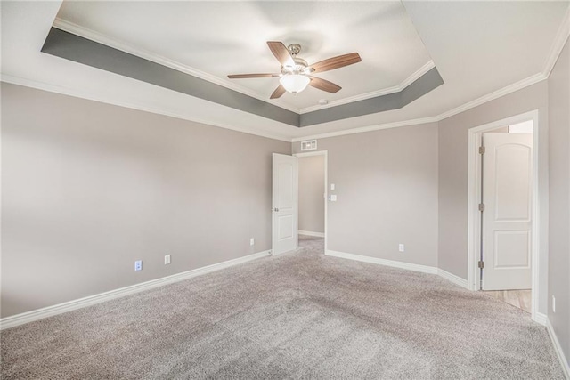 1532 SW Cross Creek Dr, Lees Summit, MO 64082 - empty room featuring a raised ceiling, a ceiling fan, crown molding, and carpet