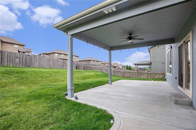 1532 SW Cross Creek Dr, Lees Summit, MO 64082 - fenced backyard with ceiling fan, a patio, and a residential view
