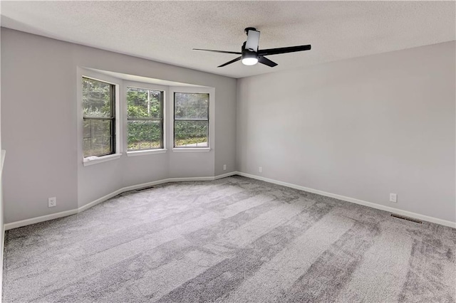 113 SE 250th Rd, Warrensburg, MO 64093 - spare room with a ceiling fan, a textured ceiling, and carpet