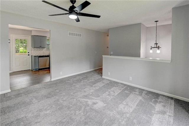 113 SE 250th Rd, Warrensburg, MO 64093 - carpeted empty room featuring a ceiling fan and a chandelier