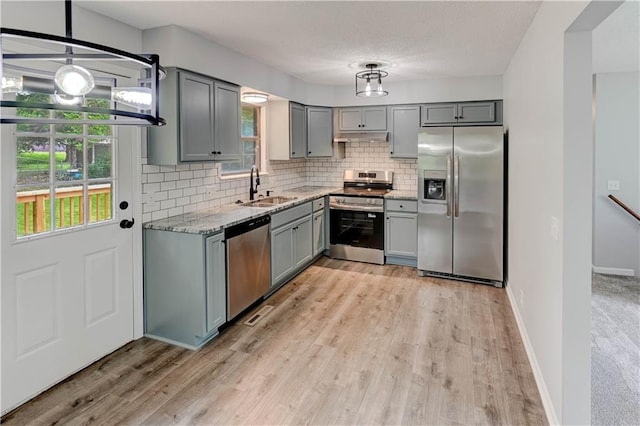 113 SE 250th Rd, Warrensburg, MO 64093 - kitchen with stainless steel appliances, gray cabinets, tasteful backsplash, and light stone counters