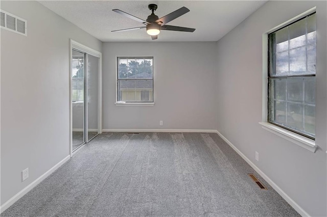 113 SE 250th Rd, Warrensburg, MO 64093 - spare room with a ceiling fan and carpet flooring