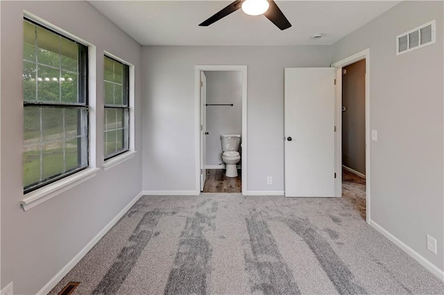 113 SE 250th Rd, Warrensburg, MO 64093 - unfurnished bedroom featuring carpet, ensuite bathroom, and a ceiling fan