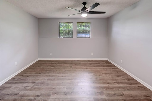 113 SE 250th Rd, Warrensburg, MO 64093 - empty room with a ceiling fan, a textured ceiling, and wood finished floors