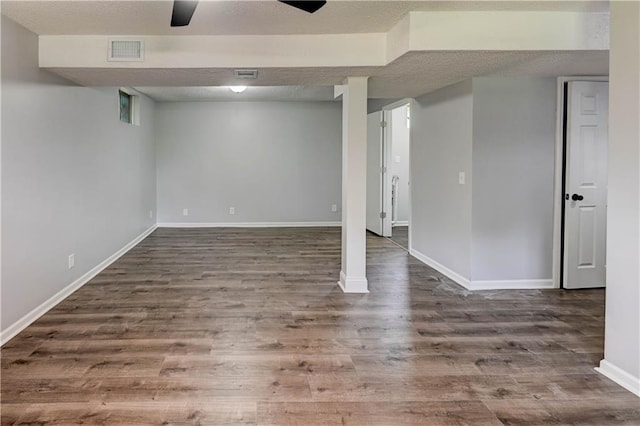 113 SE 250th Rd, Warrensburg, MO 64093 - finished below grade area with wood finished floors and a textured ceiling