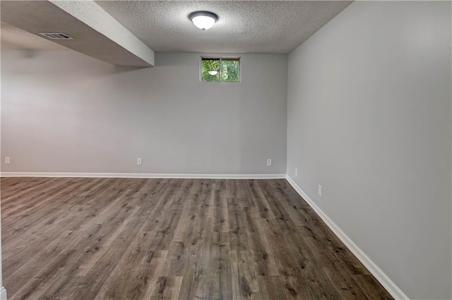 113 SE 250th Rd, Warrensburg, MO 64093 - spare room featuring wood finished floors and a textured ceiling