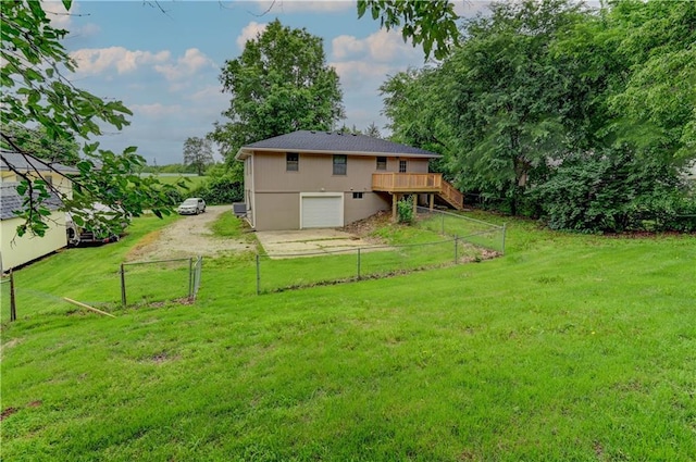113 SE 250th Rd, Warrensburg, MO 64093 - back of property featuring a garage, a deck, driveway, and stairs