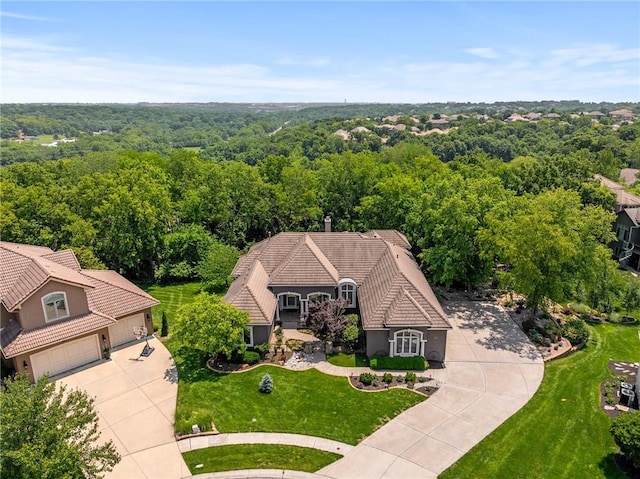 8709 Pine St, Lenexa, KS 66220 - aerial view of property and surrounding area featuring a heavily wooded area