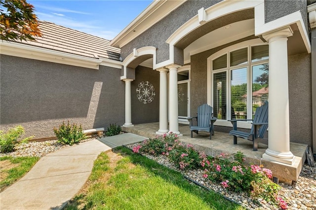 8709 Pine St, Lenexa, KS 66220 - entrance to property featuring a porch and stucco siding
