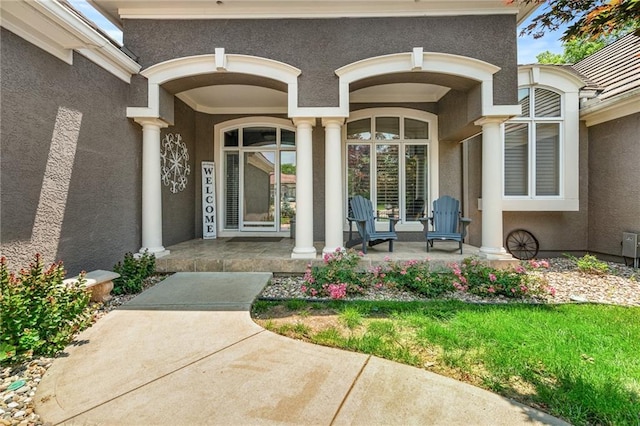 8709 Pine St, Lenexa, KS 66220 - property entrance featuring covered porch and stucco siding