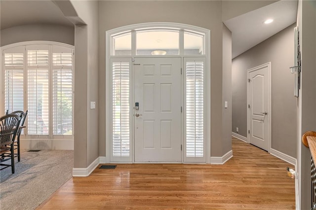 8709 Pine St, Lenexa, KS 66220 - foyer entrance featuring light wood-style flooring and baseboards
