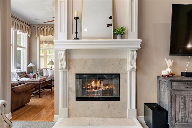 8709 Pine St, Lenexa, KS 66220 - detailed view of a premium fireplace, wood finished floors, and ornamental molding