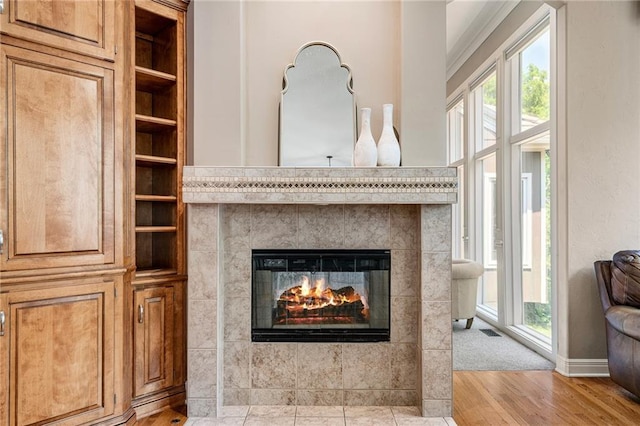 8709 Pine St, Lenexa, KS 66220 - detailed view of a tiled fireplace and wood finished floors