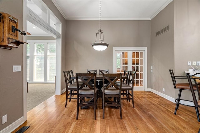8709 Pine St, Lenexa, KS 66220 - dining room with light wood-style flooring and ornamental molding