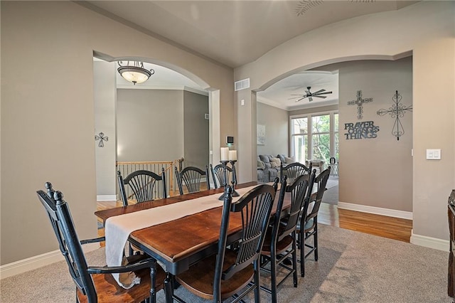 8709 Pine St, Lenexa, KS 66220 - dining space featuring arched walkways, a ceiling fan, and crown molding