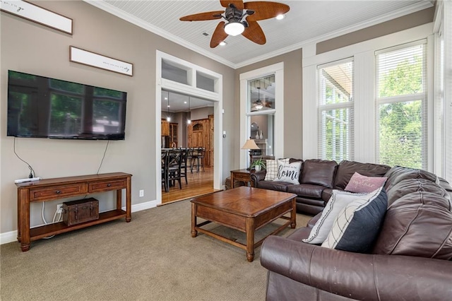 8709 Pine St, Lenexa, KS 66220 - living area with a ceiling fan, ornamental molding, and carpet floors