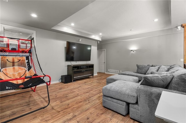 8709 Pine St, Lenexa, KS 66220 - living area with light wood finished floors, ornamental molding, and recessed lighting