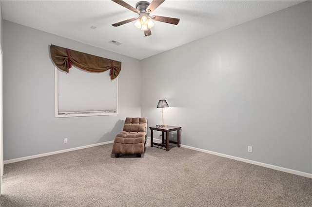 8709 Pine St, Lenexa, KS 66220 - living area featuring carpet and ceiling fan