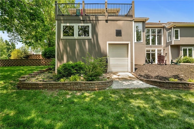 8709 Pine St, Lenexa, KS 66220 - rear view of property featuring a yard and stucco siding