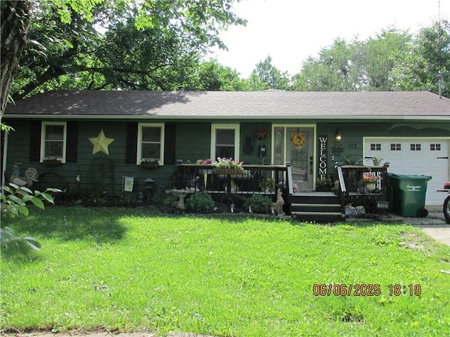 112 Spruce St, Garden City, MO 64747 - single story home with a garage, a porch, and a front lawn
