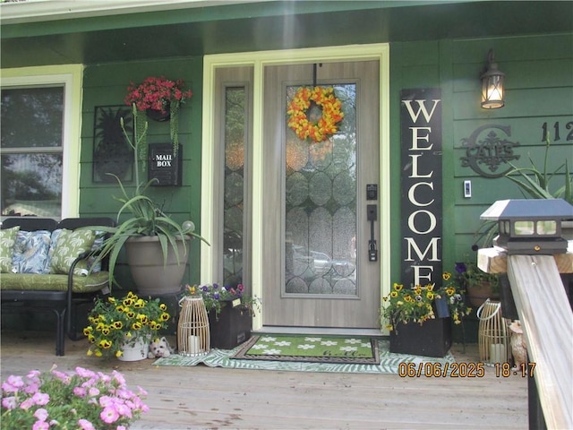 112 Spruce St, Garden City, MO 64747 - property entrance featuring covered porch