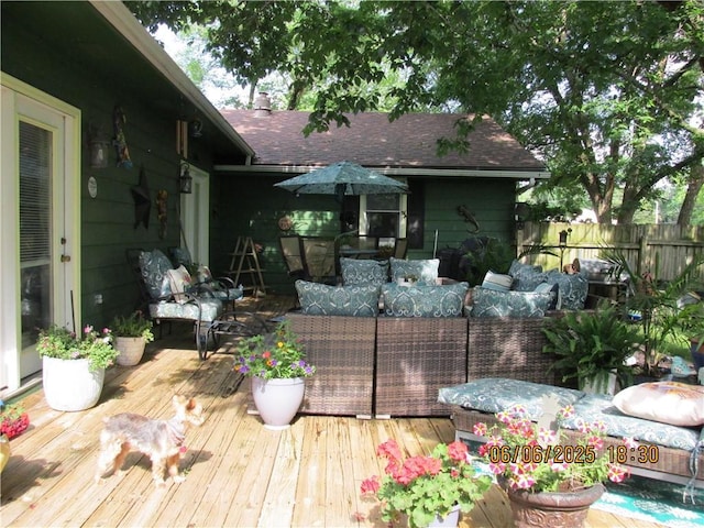 112 Spruce St, Garden City, MO 64747 - wooden deck with an outdoor living space