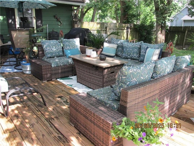 112 Spruce St, Garden City, MO 64747 - wooden terrace with an outdoor hangout area and a fenced backyard