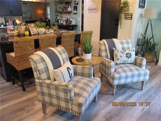 112 Spruce St, Garden City, MO 64747 - interior space featuring wood finished floors and a bar