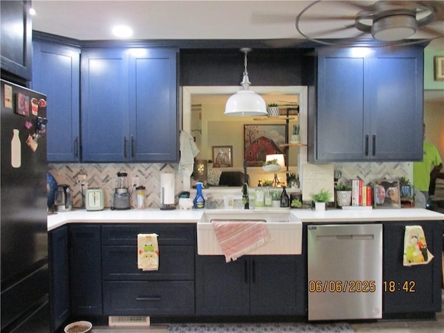 112 Spruce St, Garden City, MO 64747 - kitchen with freestanding refrigerator, stainless steel dishwasher, a sink, tasteful backsplash, and light countertops