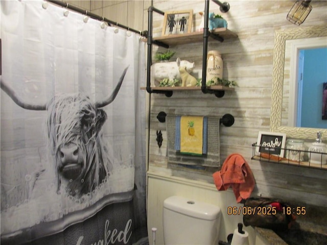 112 Spruce St, Garden City, MO 64747 - bathroom with toilet and a shower with shower curtain