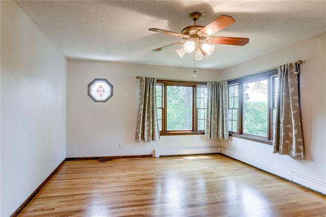 3437 Shrine Park Rd, Leavenworth, KS 66048 - empty room featuring wood finished floors, a ceiling fan, and a textured ceiling