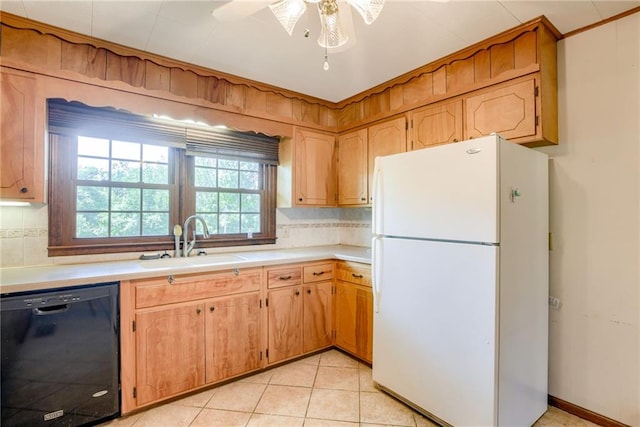 3437 Shrine Park Rd, Leavenworth, KS 66048 - kitchen featuring freestanding refrigerator, dishwasher, backsplash, and light countertops