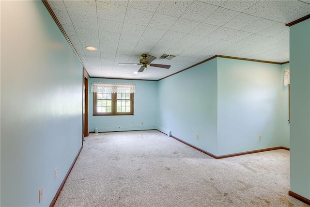 3437 Shrine Park Rd, Leavenworth, KS 66048 - spare room with crown molding, carpet flooring, baseboard heating, and a ceiling fan