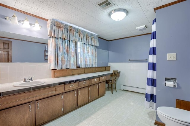 3437 Shrine Park Rd, Leavenworth, KS 66048 - full bathroom featuring a baseboard radiator, ornamental molding, tile patterned floors, a shower with shower curtain, and double vanity