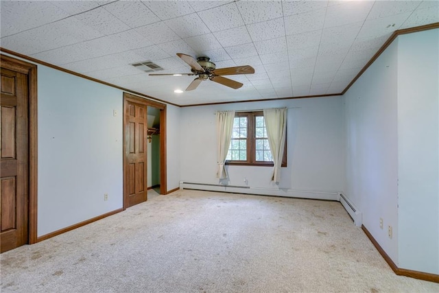 3437 Shrine Park Rd, Leavenworth, KS 66048 - spare room featuring crown molding, carpet flooring, a ceiling fan, and a baseboard heating unit