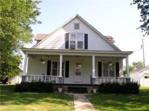 20860 P Hwy, Weston, MO 64098 - view of front of house featuring covered porch and a front lawn