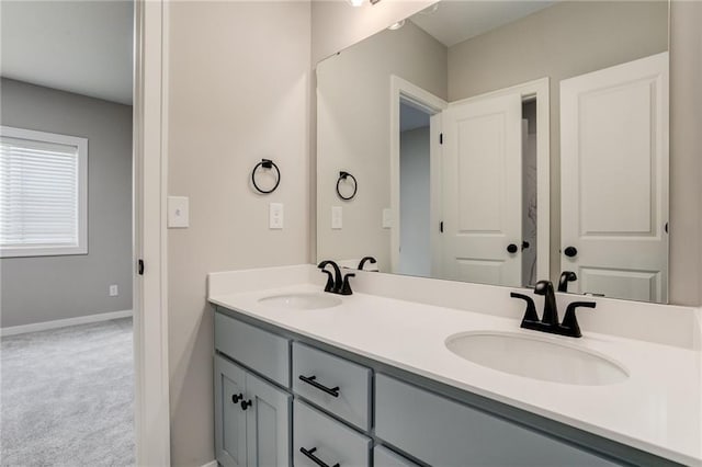 18722 W 169th Ter, Olathe, KS 66062 - bathroom featuring double vanity and baseboards