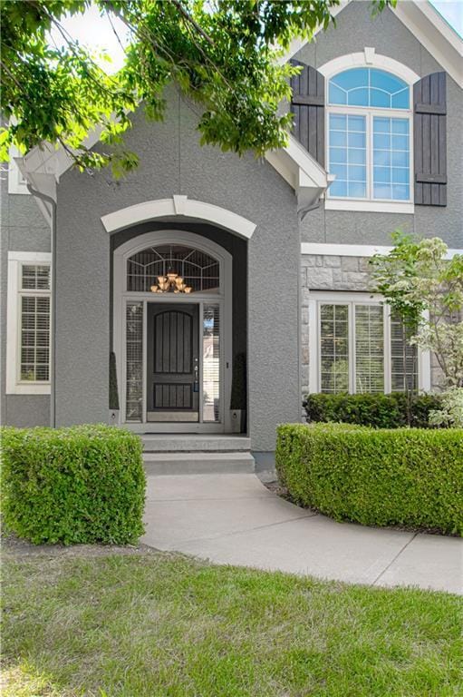 16321 Nieman Rd, Overland Park, KS 66062 - doorway to property with stucco siding