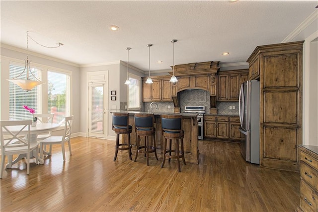 16321 Nieman Rd, Overland Park, KS 66062 - kitchen featuring stainless steel appliances, dark countertops, dark wood-type flooring, a kitchen bar, and ornamental molding