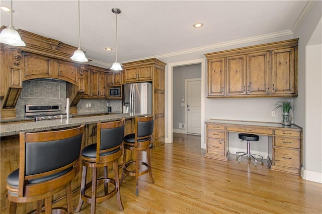 16321 Nieman Rd, Overland Park, KS 66062 - kitchen with appliances with stainless steel finishes, light wood-style floors, tasteful backsplash, brown cabinetry, and stone counters
