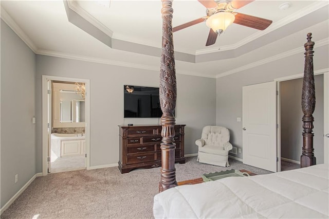 16321 Nieman Rd, Overland Park, KS 66062 - carpeted bedroom featuring a raised ceiling, ornamental molding, ensuite bathroom, and ceiling fan
