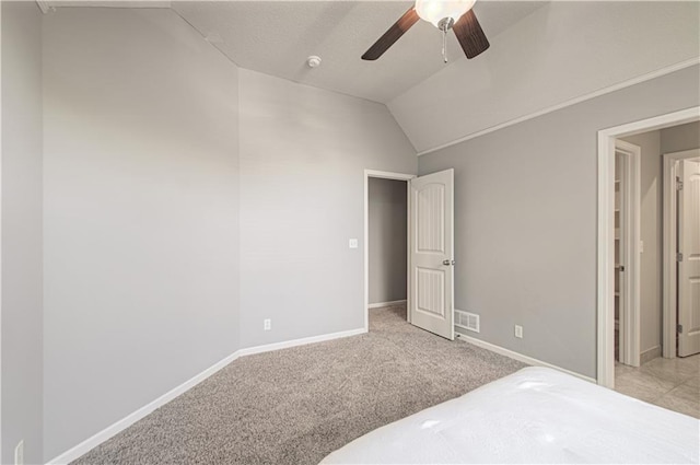 16321 Nieman Rd, Overland Park, KS 66062 - unfurnished bedroom with lofted ceiling, light colored carpet, and a ceiling fan