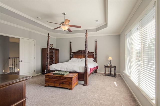 16321 Nieman Rd, Overland Park, KS 66062 - bedroom featuring light carpet, a tray ceiling, ornamental molding, and ceiling fan