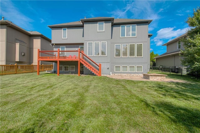 16321 Nieman Rd, Overland Park, KS 66062 - rear view of property with stairs, a wooden deck, and a fenced backyard