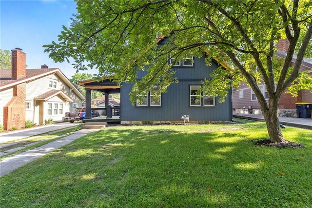 17 E 65th Ter, Kansas City, MO 64113 - view of front of home with a front yard and covered porch