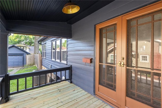 17 E 65th Ter, Kansas City, MO 64113 - wooden terrace featuring a storage shed and french doors