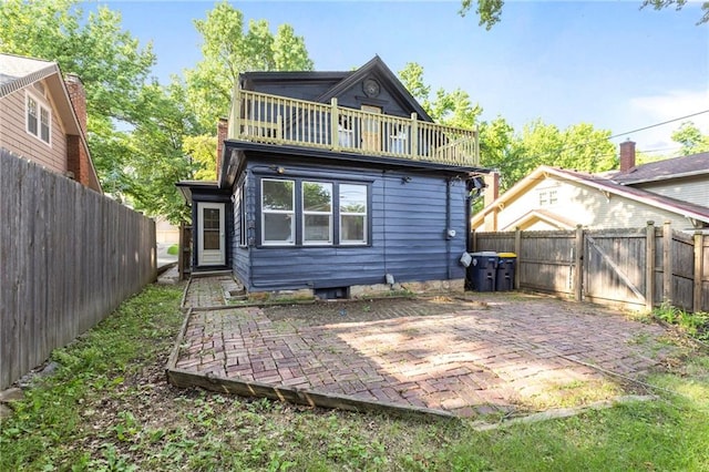 17 E 65th Ter, Kansas City, MO 64113 - rear view of property featuring a patio area and a fenced backyard