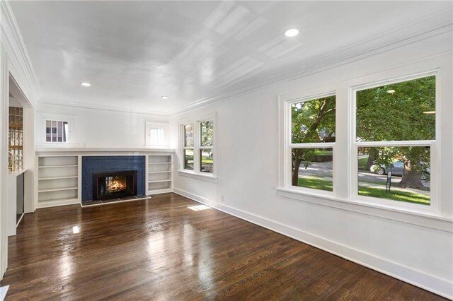 17 E 65th Ter, Kansas City, MO 64113 - unfurnished living room featuring ornamental molding, a fireplace, wood finished floors, and recessed lighting