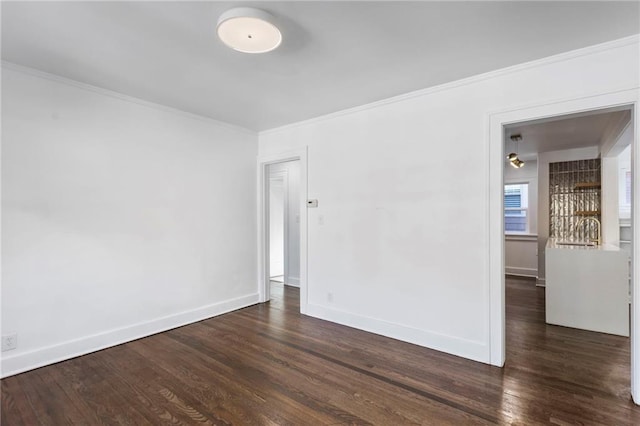 17 E 65th Ter, Kansas City, MO 64113 - spare room featuring dark wood-style floors and crown molding